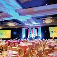 event planners organizing hall setup for exhibition in Dehradun